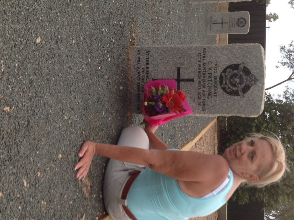 Marion Weatherburn laying flowers at Sergeant Charles “Chas” Patching’s grave at Geraldton War Cemetery, Western Australia